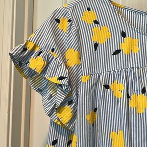 Crown & Ivy blue, and white striped shirt with flower detail.